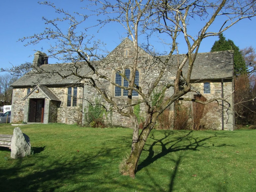 Historic stone church and churchyard on a sunny day